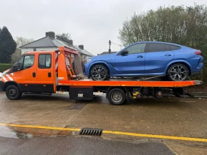 Blue BMW SUV loaded onto a recovery truck by White Recovery providing car and van recovery services in Barking