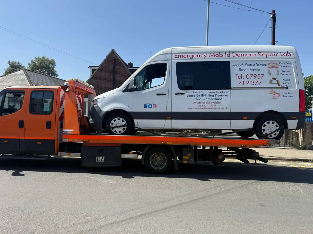 24-hour car and van recovery service in Ealing London by White Recovery transporting a commercial van on a flatbed recovery truck