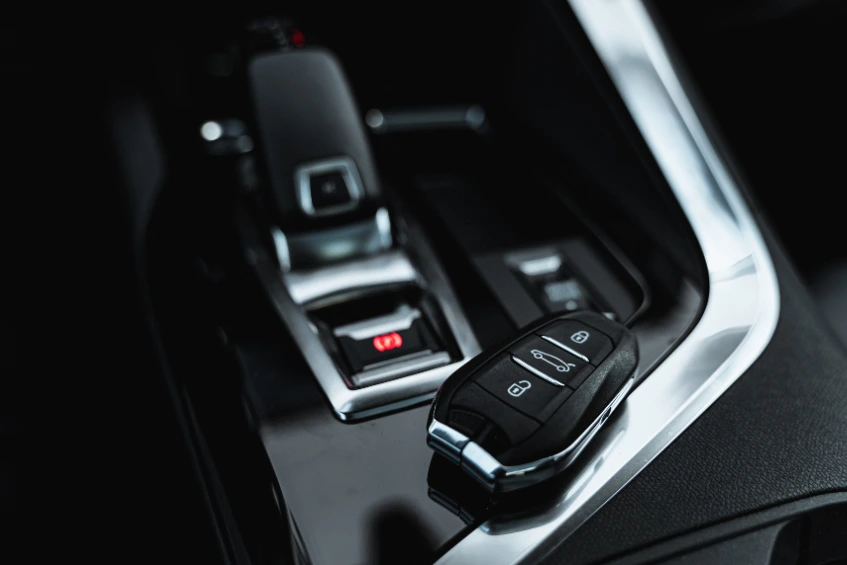 Car keys locked inside a vehicle with key fob on the centre console, representing emergency car lockout assistance and vehicle recovery services in London.