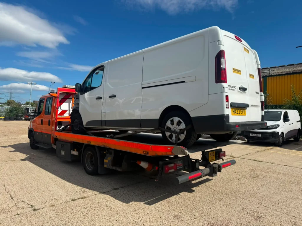 Van recovery on a flatbed recovery truck in Chelsea London